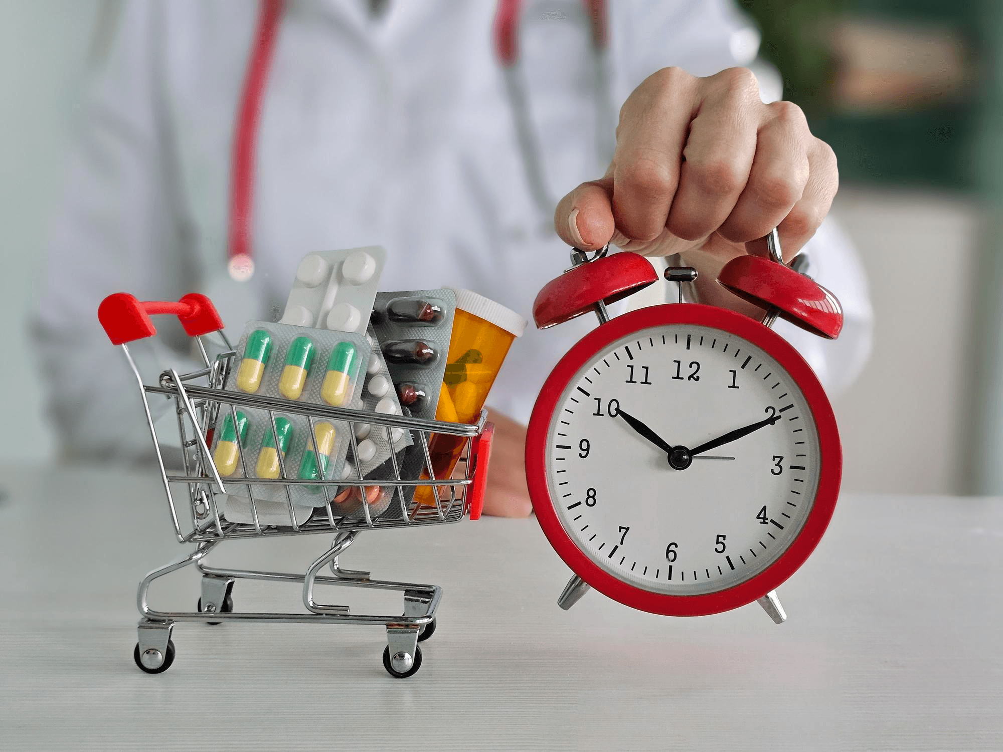 Medicines and clock showing zero waiting period insurance.